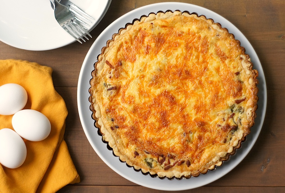 Quiche with Arugula, Bacon, + Cheddar