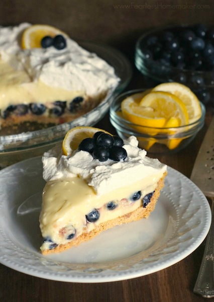 Lemon-Blueberry Cream Pie: Citrusy, bright lemon cream pie full of fresh blueberries, whipped cream + a graham cracker crust. A perfect summertime pie! www.FearlessHomemaker.com